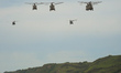 U.S. Army military helicopters seen over Omaha Beach near Colleville-sur-Mer, on Sunday, J...