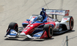 Tony Kanaan (14) of Brazil and A.J. Foyt Enterprises makes the turn during the Chevrolet D...