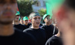 Young Palestinian boys take part in a military camp to teaching how to fire Kalashnikov as...