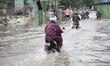 Motor cycles rides on the flood on February 19, 2015 in Mangga Dua-Jakarta hit by flood ag...