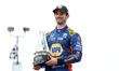 Alexander Rossi (27) of United States and Andretti Autosport holds the trophy after taking...
