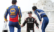 Josef Newgarden talks with Alexander Rossi and Takuma Sato while cooling of in the Scott M...