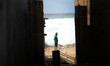 Young man looking to the sea and the high waves during a windy day on February 20, 2015 in...