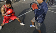 Boxers in a friendly match during the "Happy Streets" day in Kolkata, India. 
On February...