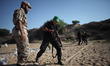 Military trainers of Al-Qassam Brigades "the military wing of Hamas"  teaching Palestinian...
