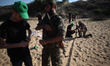 Military trainers of Al-Qassam Brigades "the military wing of Hamas"  teaching Palestinian...
