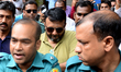 Former officer-in-charge of Sonagazi Police Station Moazzem Hossain (C) has been produced...