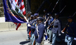 Elected officials, community leaders, youth and drum and marching bands take part in the s...