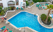 Swimming pool during the day and night at a luxury all-inclusive holidays hotel with view...