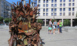People walk past the iron Throne installed at Independence Square in Kyiv,  Ukraine,  June...