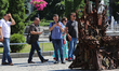 People take pictures of iron Throne installed at Independence Square in Kyiv,  Ukraine,  J...