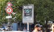 Illustration of a billboard of the city of Paris which still displays a temperature of 35°...