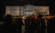 Protesters march in front of the Greek Parliament in central Athens during an anti-EU prot...