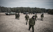 Cadets walking to the station after an exercise during training of driving armed vehicles...
