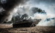 Cadets drive the BMP-1 infantry fighting vehicle during full-scale rehearsal of military m...