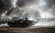 Cadets drive the BMP-1 infantry fighting vehicle during full-scale rehearsal of military m...