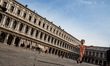 A toddler plays on San Marco square in Venice, Italy on June 4, 2019. 