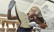A Sotheby’s auction worker holds the original and first management contract between member...