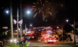 People in Redondo Beach, CA, USA gather to watch a display of fireworks being launched fro...