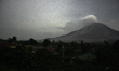 This photo was taken on February 28, 2015 with a long exposure shows Sinabung volcano spew...