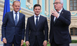 President of Ukraine Volodymyr Zelenskiy (C) talks the President of the European Council D...
