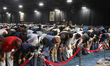 Thousands of Muslims participate in a group prayer during the 43rd Jalsa Salana (annual co...