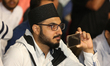 Man records a video as Maulana Mubashir Ahmad Khan Sahib speaks during the 43rd Jalsa Sala...