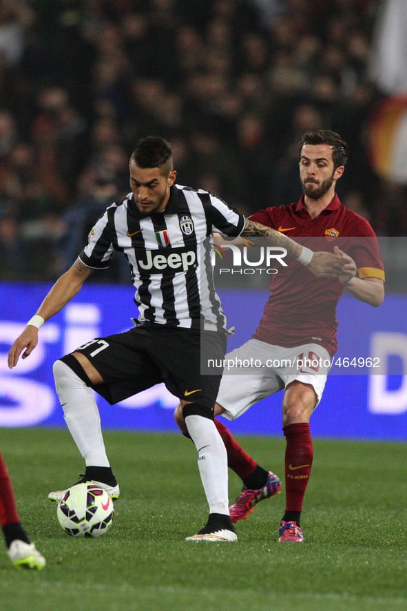Juventus midfielder Roberto Pereyra (37) fights for the ball against Roma midfielder Miralem Pjanic (15) during the Serie A football match n...