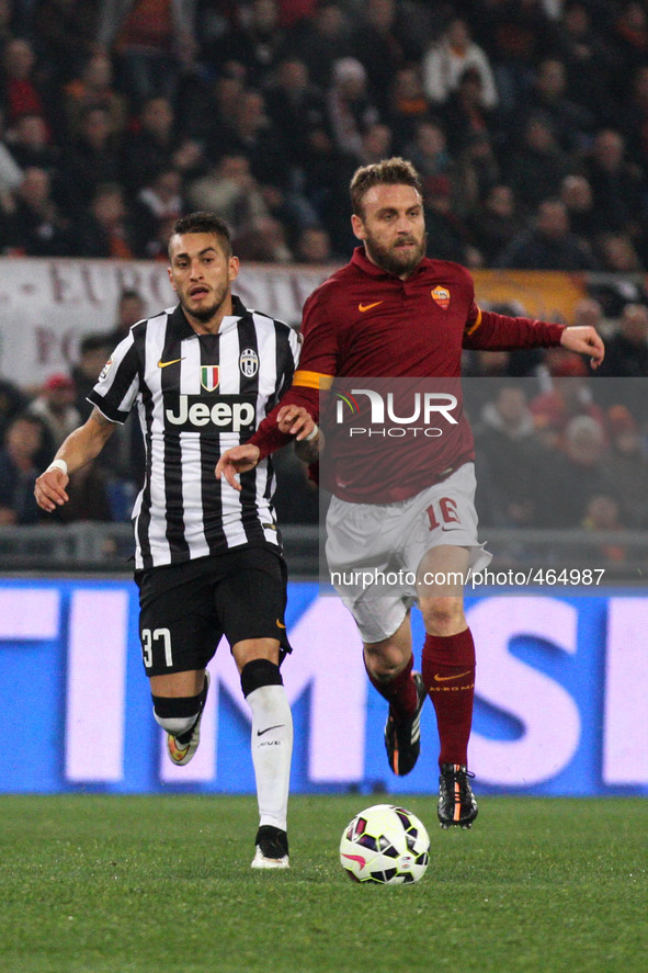 Juventus midfielder Roberto Pereyra (37) fights for the ball against Roma midfielder Daniele De Rossi (16) during the Serie A football match...