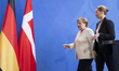 German Chancellor Angela Merkel and Danish Prime Minister Mette Frederiksen leave after a...