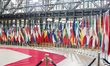 EU flags and flags of the European countries state member next to the red carpet where EU...