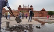 Employees clean a Gutter infront of The Red Fort in Delhi, India, on 20 July 2019., India 