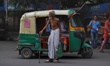 An Elderly man waits to cross the road outside the Ref Fort in Old Delhi, India, on 20 Jul...