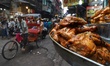 Non Veg items are displayed outside a shop as commuters move near Jama Masjid in Old Delhi...