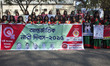 Making slogan "Empowering Women - Empowering Humanity" women from different community gath...