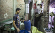 Two young worker in a factory of the recycling of plastic, in the district of Mokattam (th...