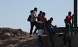 Family manages to dodge the national guard and pass the Rio Grande that divides Ciudad Jua...