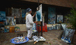 An artist paints on the main street in Beuvron-en-Auge.On Friday, August 2, 2019, in Caen...