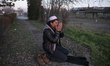 An Afghan migrant prays at at a camp at an abandoned brick factory outside the Serbian bor...