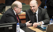Irish Finance Minister Michael Noonan (L) talks with Pierre Moscovici , EU commissioner fo...