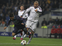 Porto's Spanish forward Cristian Tello and Basel's defender Walter Samuel during the UEFA Champions League match between FC Porto and FC Bas...
