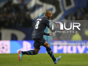 Porto's Algerian midfielder Yacine Brahimi celebrates after scoring a goal during the UEFA Champions League match between FC Porto and FC Ba...