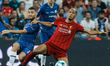 Fabinho (R) of Liverpool and Mateo Kovacic (L) of Chelsea vie for the ball during the UEFA...