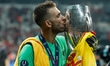 Adrian of Liverpool celebrates with the trophy during the UEFA Super Cup match between Liv...