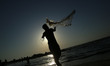 A Palestinian fisherman casts his net  in the Mediterranean sea during hot weather in Gaza...