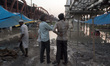 People collect their essentials as they vacate their homes near the Old Yamuna Bridge as w...