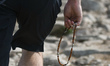 A tourist carries a rosery when walking on a rocky trail direction Kasprowy Wierch.Thanks...