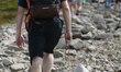 A tourist carries a rosery when walking on a rocky trail direction Kasprowy Wierch.Thanks...