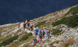 Tourists walk on a rocky trail direction Kasprowy Wierch.Thanks to the sunny weather at t...