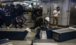 Protester are seen pushing barricades on the ground in Hong Kong on August 21, 2019, Thous...